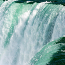 Picture of a powerful waterfall with rushing water cascading downward